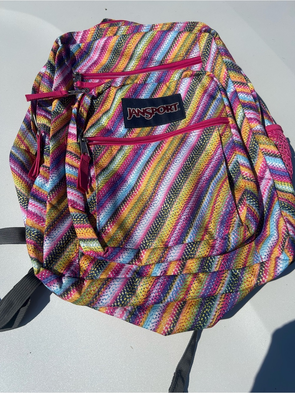 Backpack w/ multiple zipper compartments.